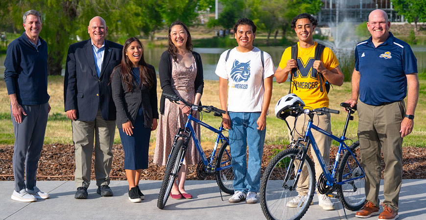 People posing for donated bikes story